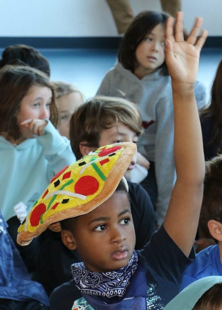 Student with pizza hat